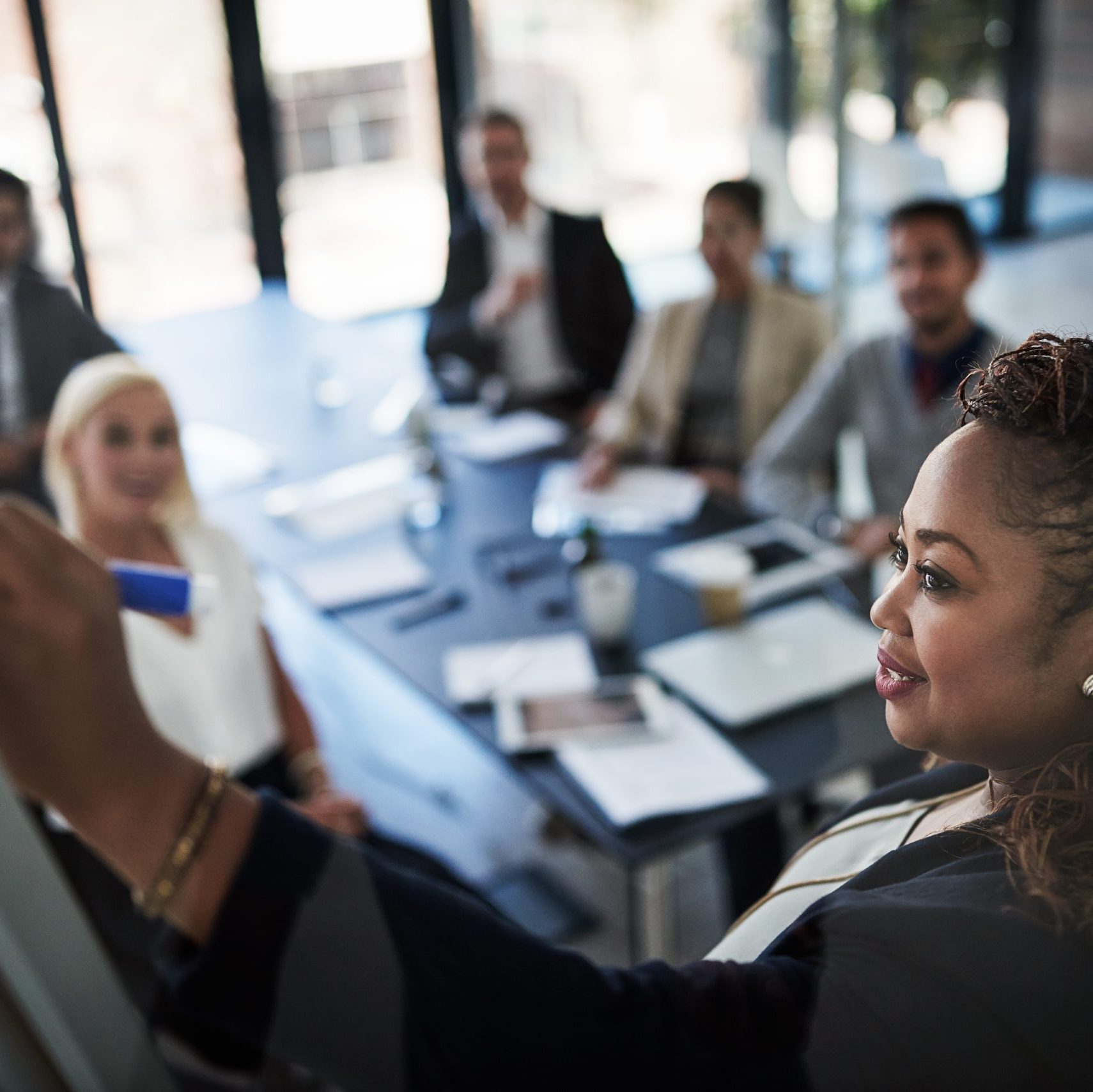 Photo of business people in an office having a meeting.